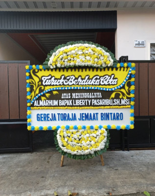 Papan Bunga Duka di Kairagi Weru
